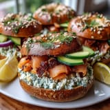 Vibrant smoked salmon bagel board with cream cheese, fresh veggies, and garnishes—perfect for spring brunch gatherings.