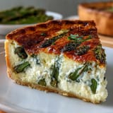 A golden quiche filled with tender asparagus and creamy Brie, perfect for an elegant Mother's Day brunch.