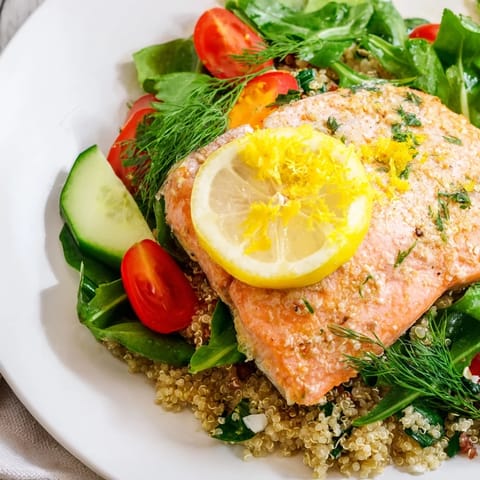 Vibrant Lemon Herb Salmon Salad featuring tender salmon, fresh herbs, cherry tomatoes, and cucumber, all tossed in a zesty lemon dressing.  