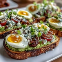Spring Brunch Avocado Toast Board with Toppings, a colorful spread of creamy avocado on golden sourdough topped with radishes, cherry tomatoes, and microgreens.